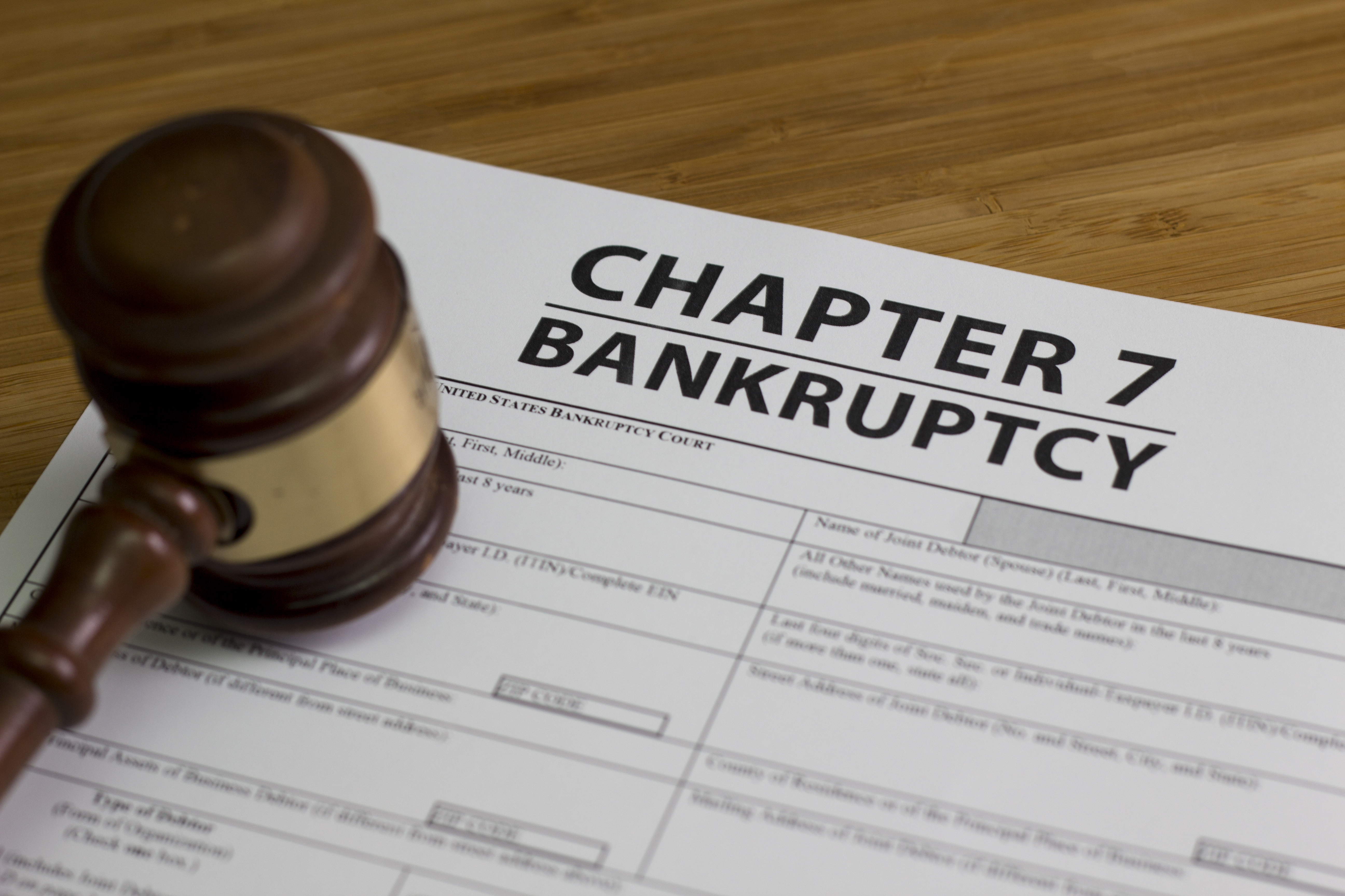 A gavel on a chapter 7 bankruptcy form